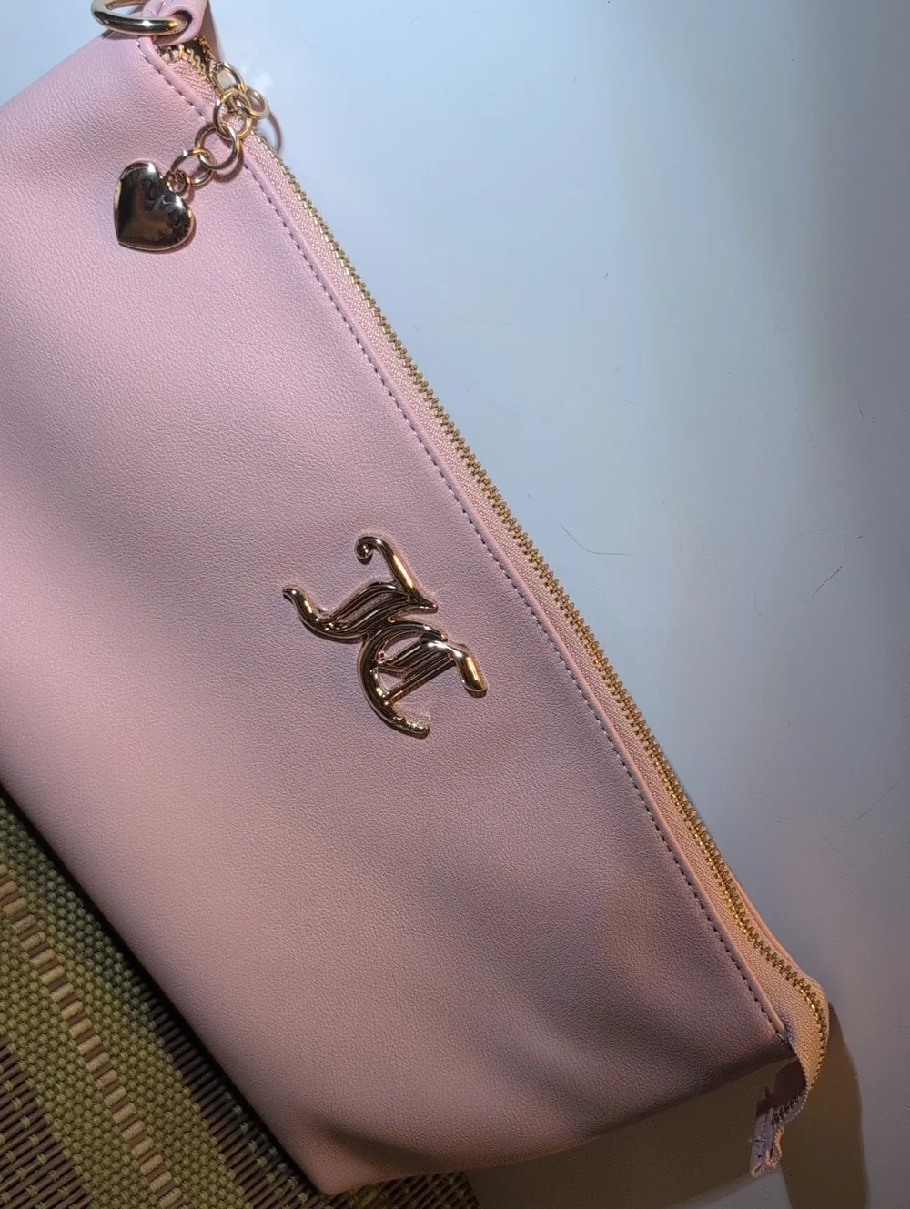 Juicy Couture Light Pink Vegan Leather Clutch Bag With Gold Hardware.